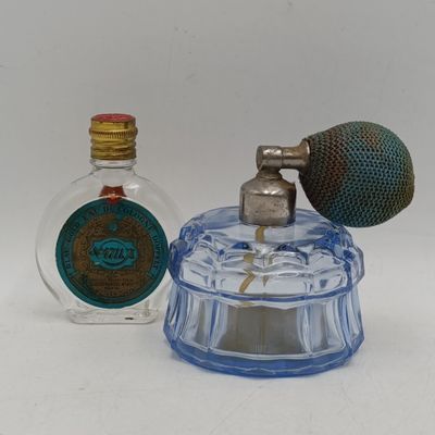 Lot of 2 vintage glass perfume bottles - one with labels
