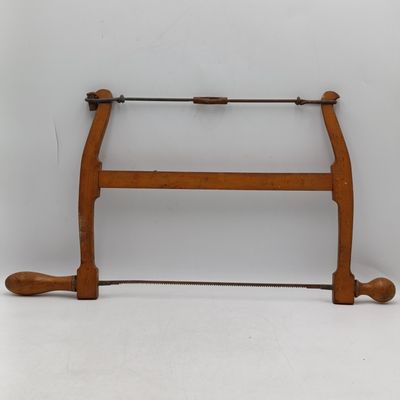 Antique wooden bow saw