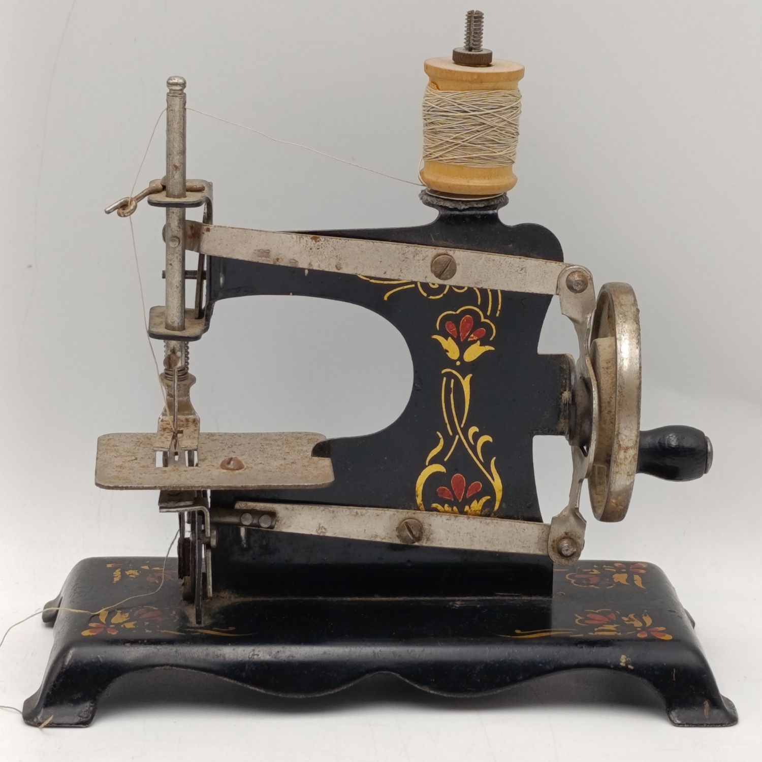 Antique children's sewing machine toy