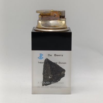 Vintage De Beers table lighter with rough diamond in blue ground resin base