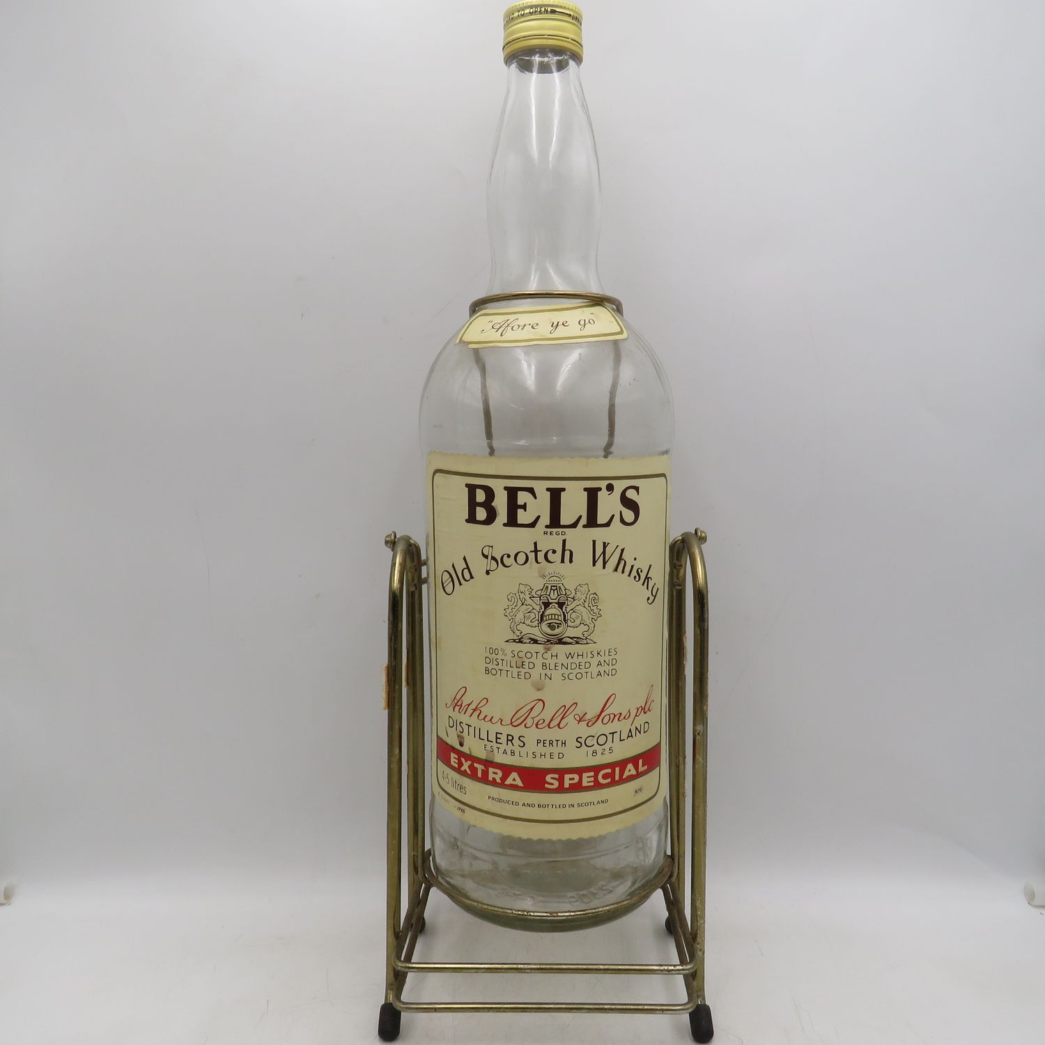 Bell's Scotch Whisky 4.5lt glass bottle on tipping stand - Empty