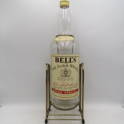 Bell's Scotch Whisky 4.5lt glass bottle on tipping stand - Empty