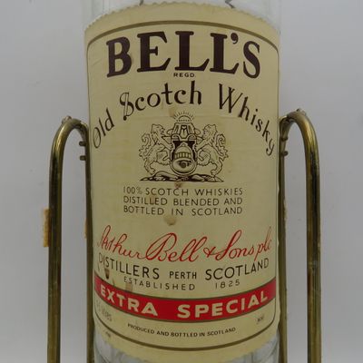 Bell's Scotch Whisky 4.5lt glass bottle on tipping stand - Empty