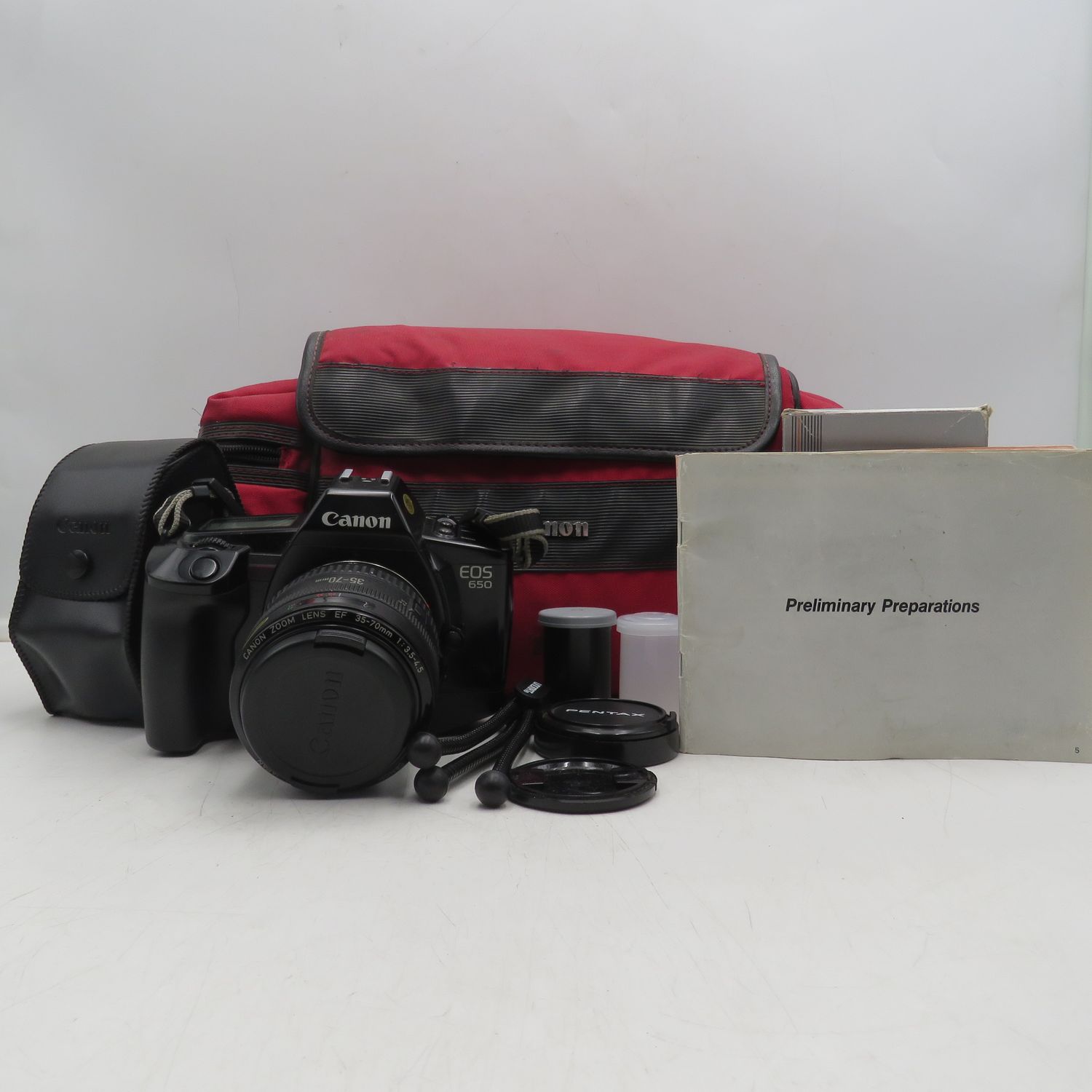 Canon EOS 650 SLR 35mm film camera with 2 extra Speedlite flashes in bag - camera needs a battery, not tested