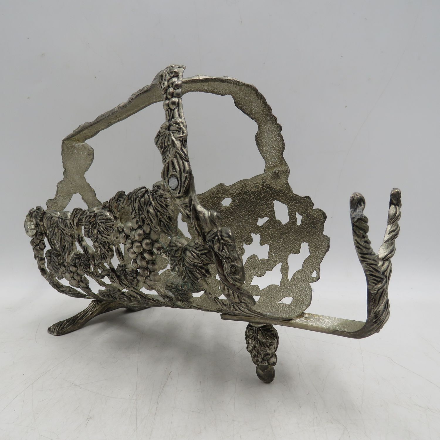 Vintage silverplated vintner motif wine bottle stand