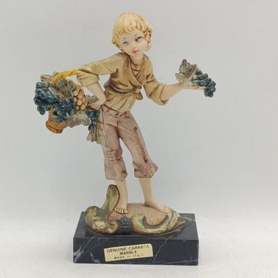 Vintage Simonelli resin sculpture of boy holding grapes