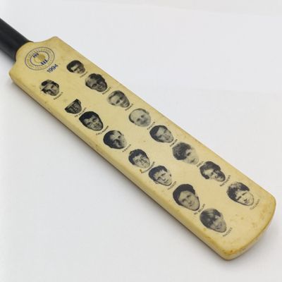 1994 United Cricket Board South African cricket team miniature cricket bat with photos of each player