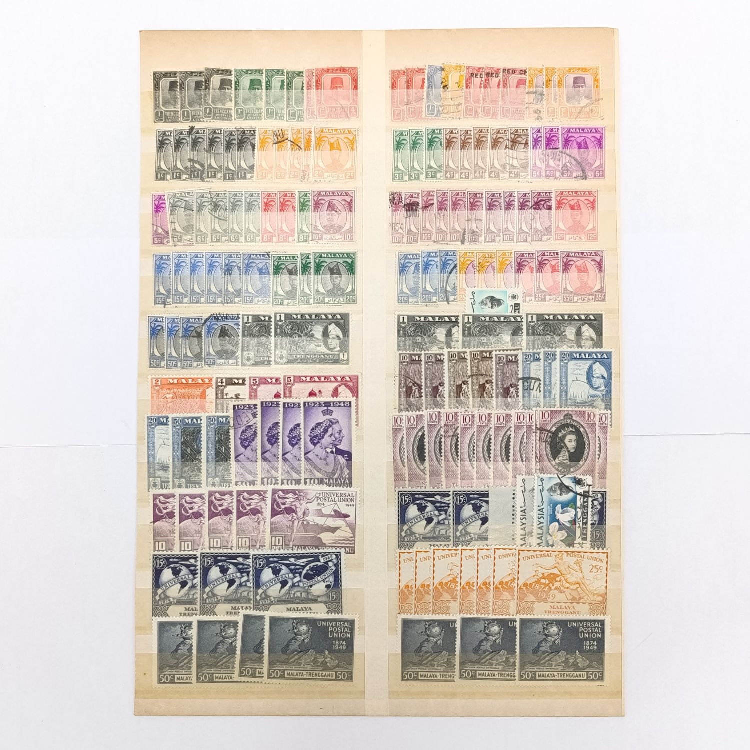 Malaya Trengganu page with over 150 stamps - both used and mint