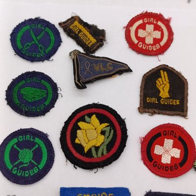 Large lot of vintage Girl Guides cloth and metal badges