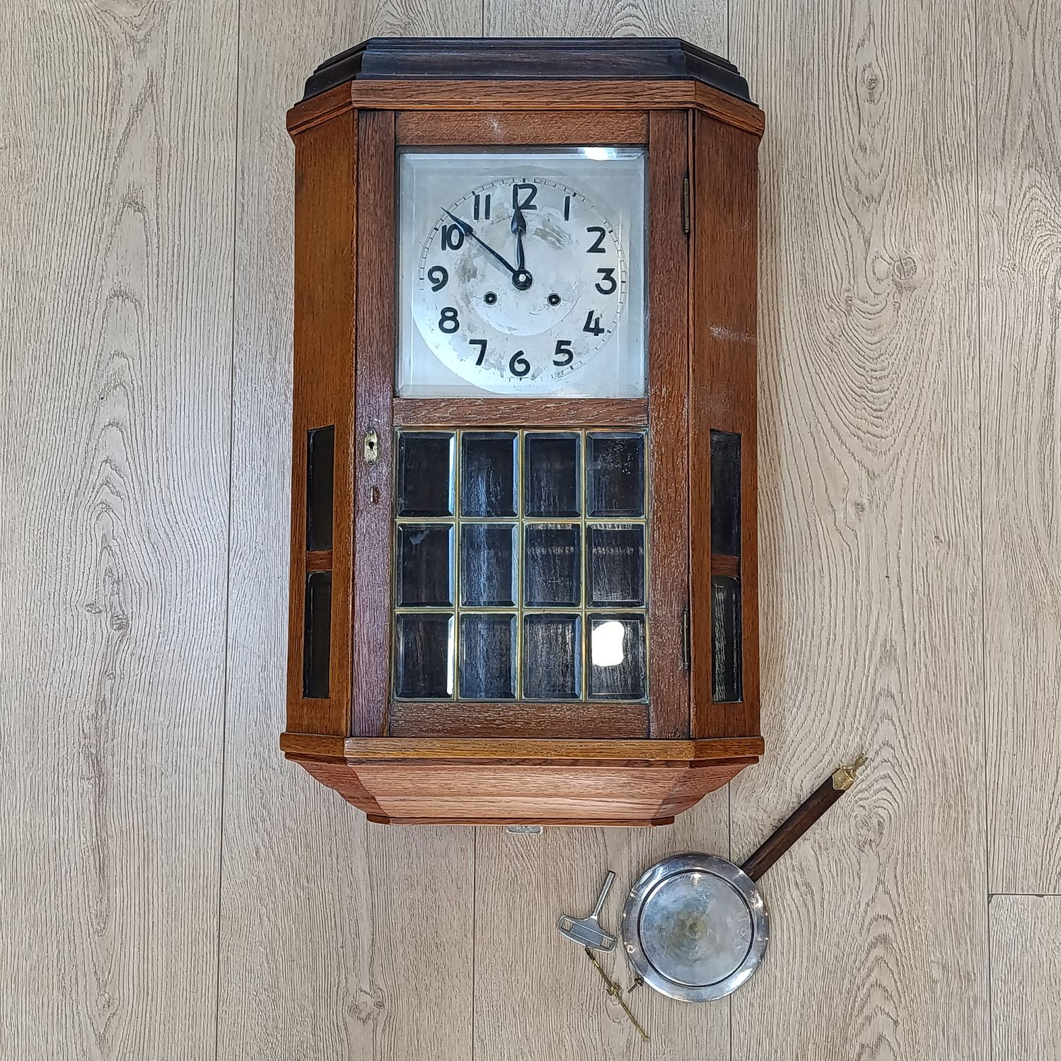 Antique German wooden wall hanging clock with bevelled glass