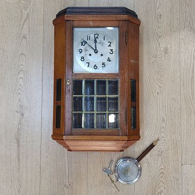 Antique German wooden wall hanging clock with bevelled glass