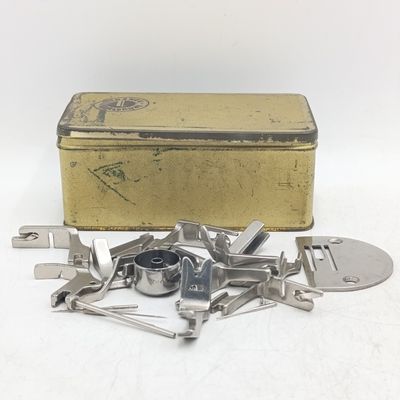 Box with needlework machine parts &amp; shoes