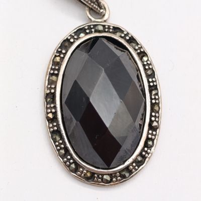 Obsidian Volcanic glass set in sterling silver pendant - weighs 14.3 grams with marcasites