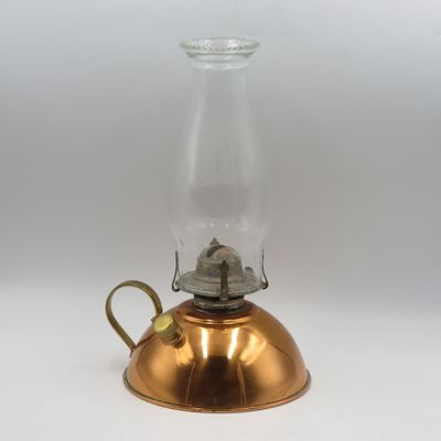 Vintage copper oil lantern with brass handle and glass chimney