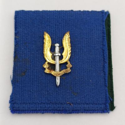 Rhodesian SAS and Selous Scouts badges on material backing - possibly from Reuteler set