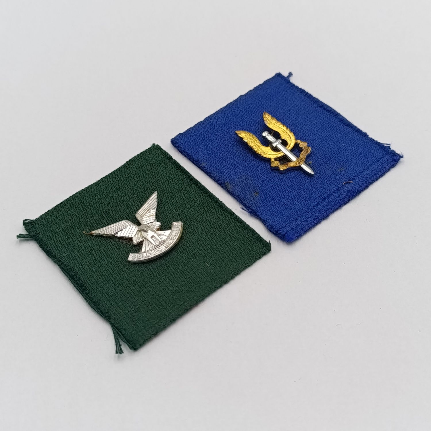 Rhodesian SAS and Selous Scouts badges on material backing - possibly from Reuteler set