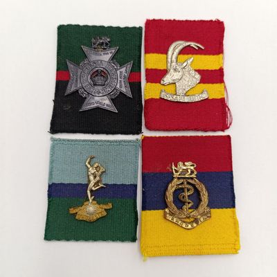 Lot of 4 Rhodesian badges on material backing - possibly from Reuteler set