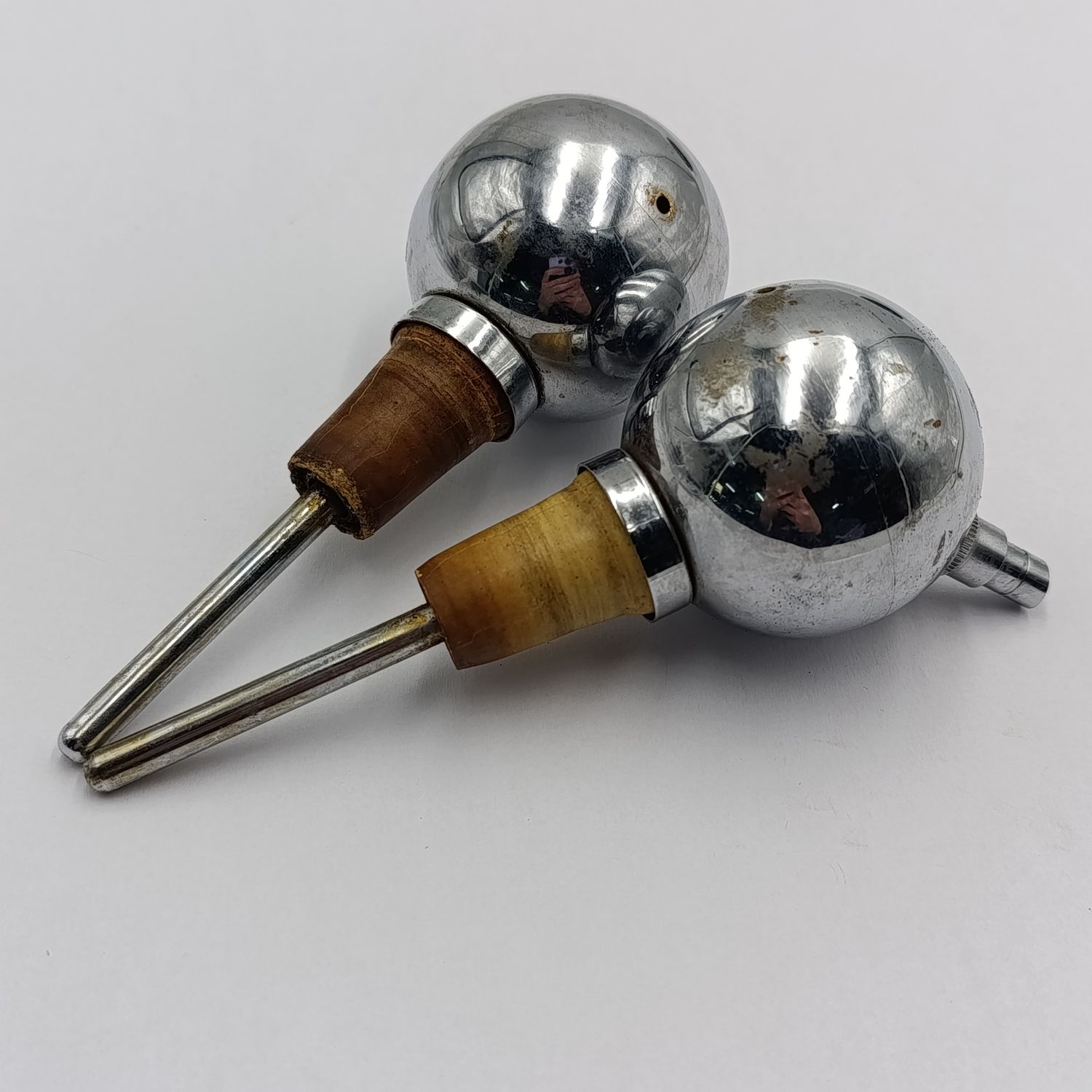 Pair of vintage ball shaped spirit pourers