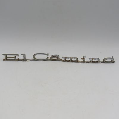 Pair of vintage Chevy El Camino car badges plus an extra broken one