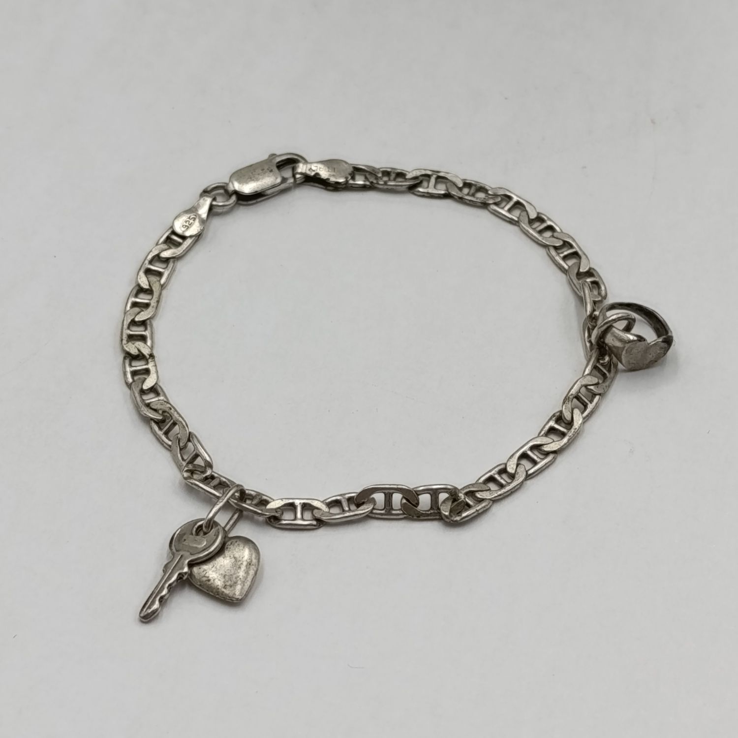 Sterling silver bracelet with 2 charm pendants - weighs 6 grams