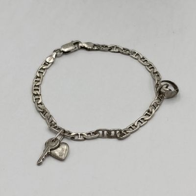 Sterling silver bracelet with 2 charm pendants - weighs 6 grams