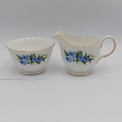 Queen Anne floral design porcelain milk jug and sugar bowl