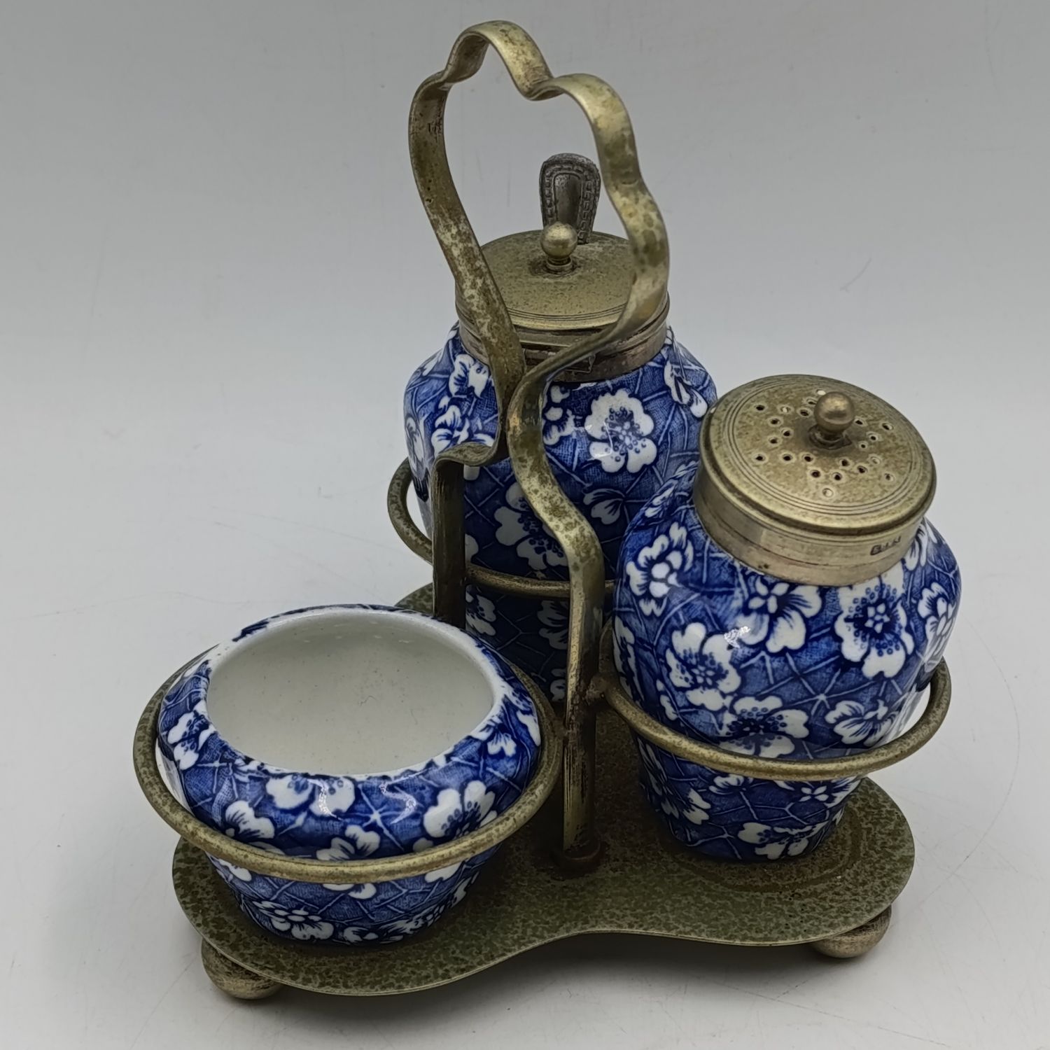 Antique blue and white porcelain condiment set in EPNS stand