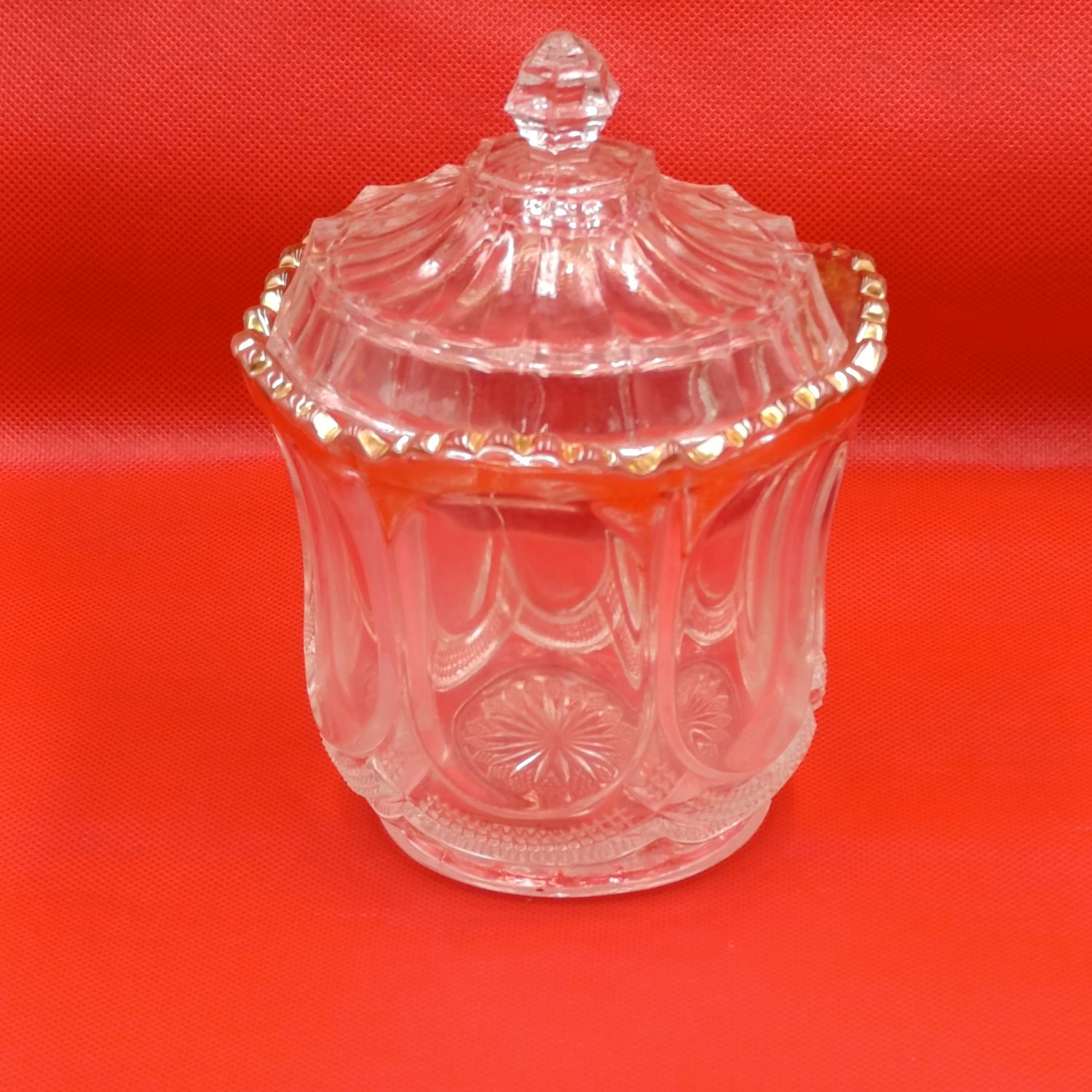 Antique glass jar with lid and gold accents