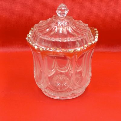 Antique glass jar with lid and gold accents