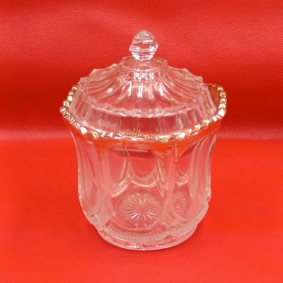 Antique glass jar with lid and gold accents