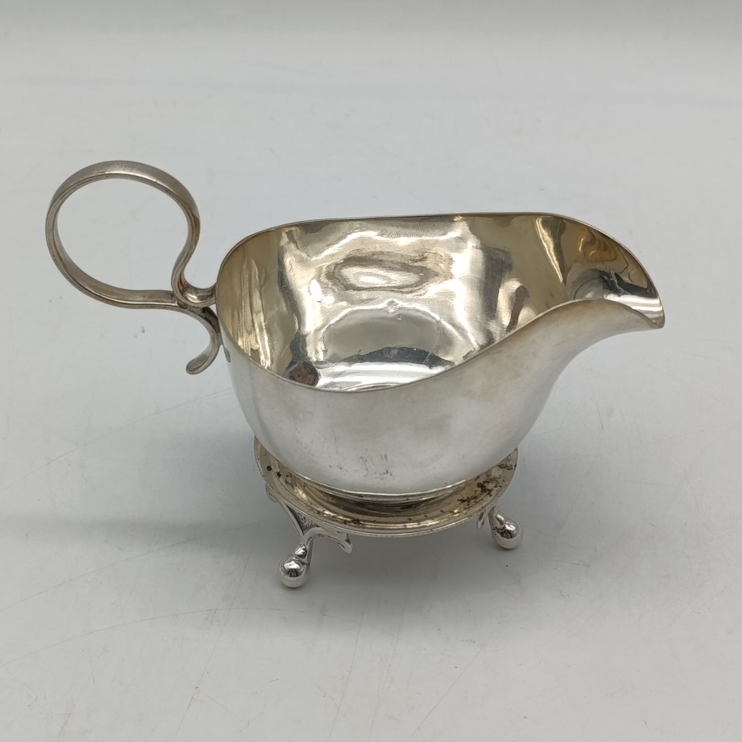 Silverplated sauce boat with stand