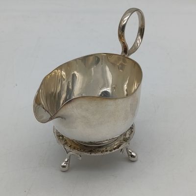 Silverplated sauce boat with stand