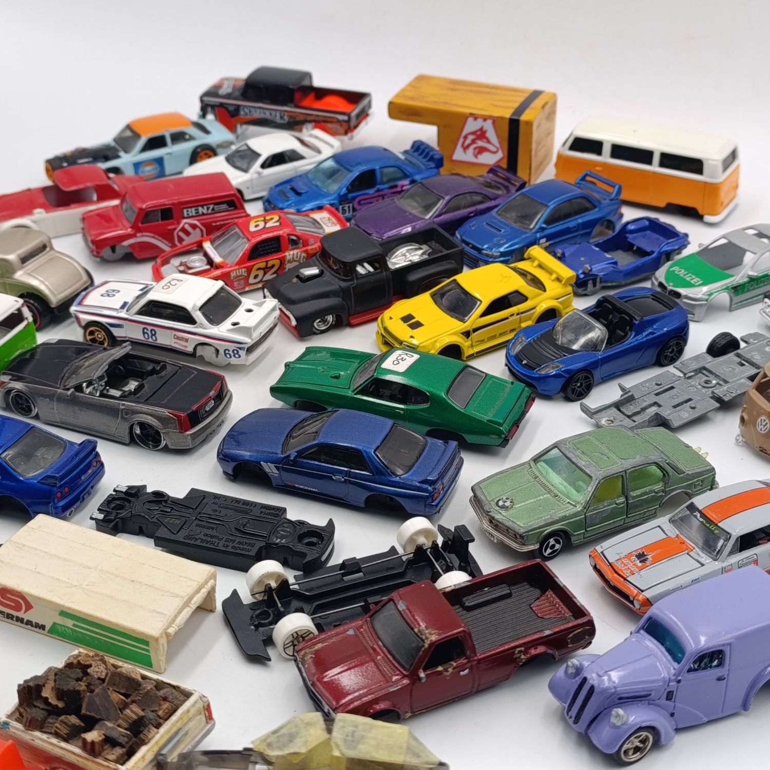 Large lot of die-cast toy car spares and parts