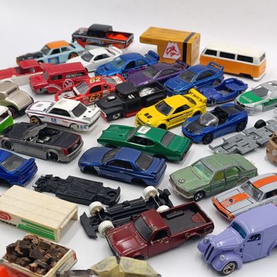 Large lot of die-cast toy car spares and parts