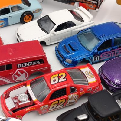 Large lot of die-cast toy car spares and parts
