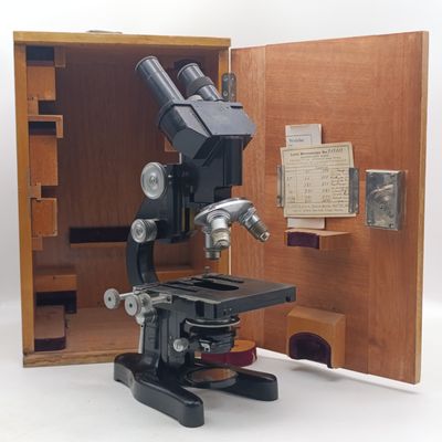 Vintage E'Leitz Wetzlar micropscope with extra lenses and filters ion original wooden carry box