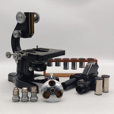 Vintage E'Leitz Wetzlar micropscope with extra lenses and filters ion original wooden carry box