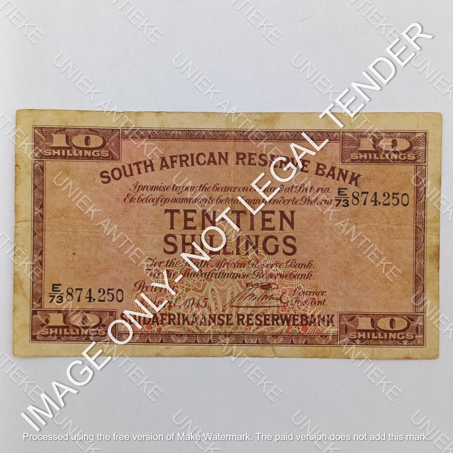 South Africa J Postmus 1945 Ten Shillings banknote - small bottom tear - still a nice note