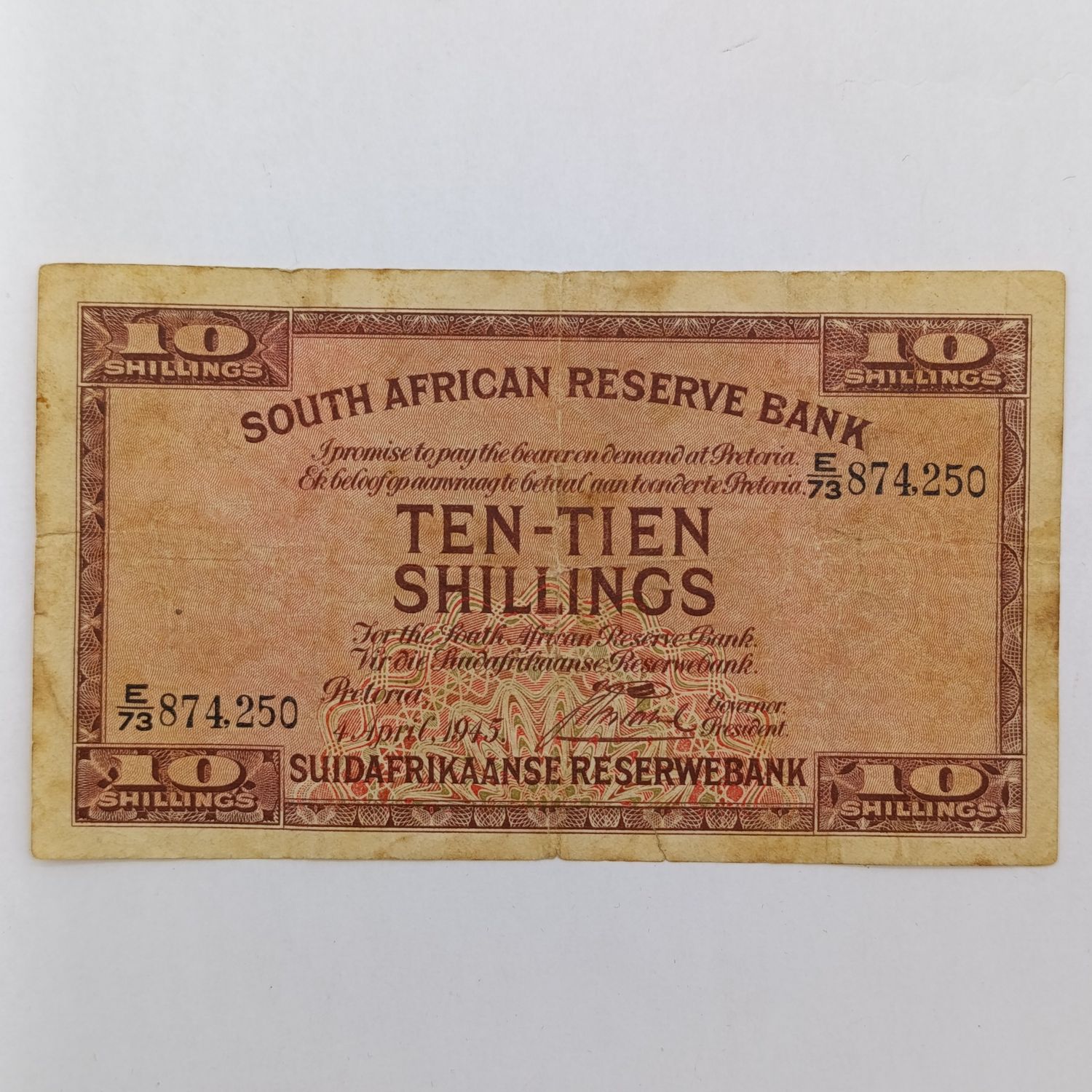 South Africa J Postmus 1945 Ten Shillings banknote - small bottom tear - still a nice note
