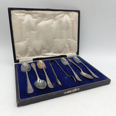 Vintage set of teaspoons with sugar tongs in case