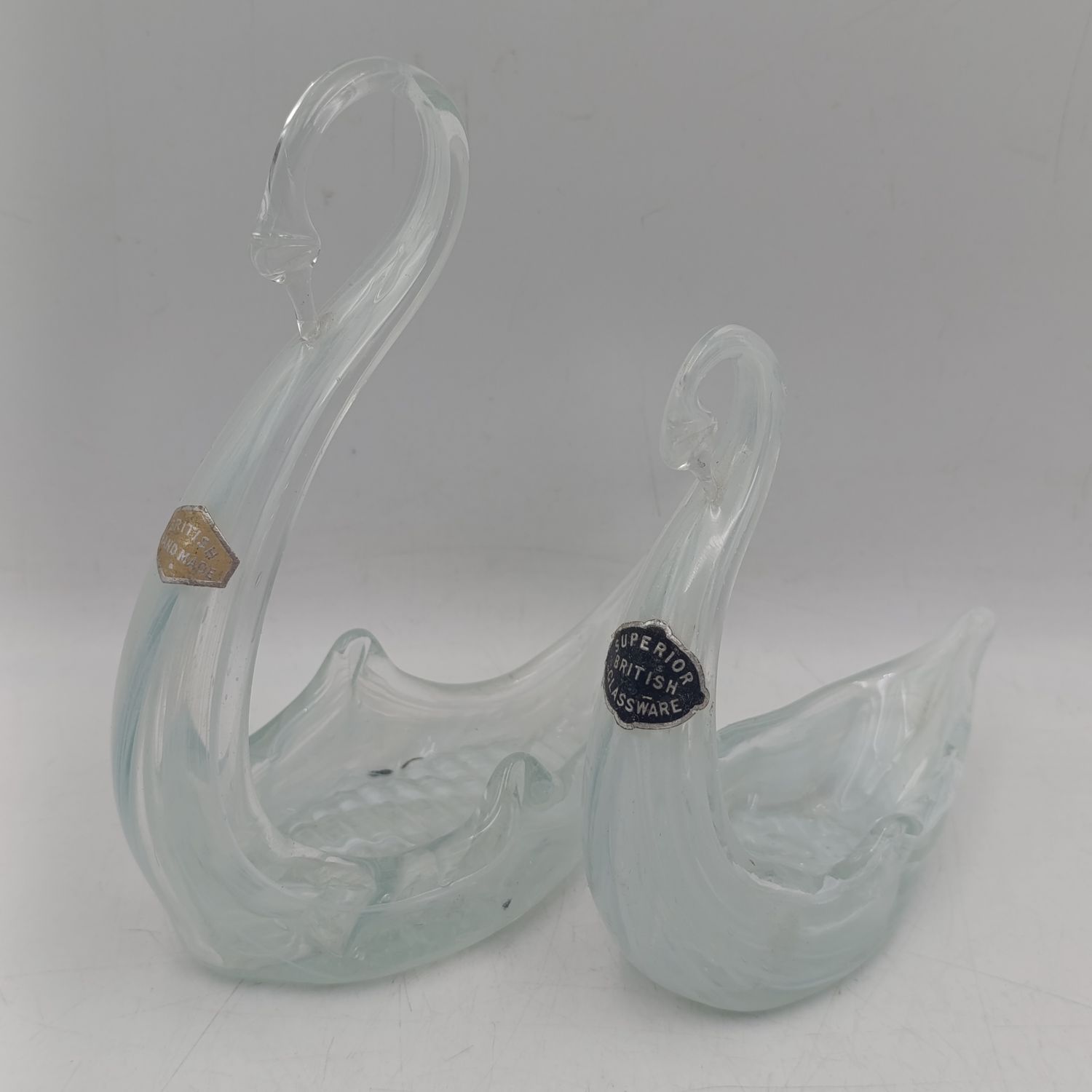 Pair of vintage British-made slat glass swans