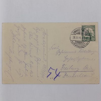 1911 german Colonial Postcard Swakopmund to Freiburg, Baden ,Germanny - with 5 Pfennig Kaiser yacht Stamp and clear cancellation and 54 Routing Mark - Picture of Magistrates Court in Swakopmund