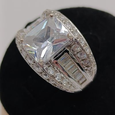 Sterling silver ring with large center stone and 50 smaller stones - weighs 7.4g