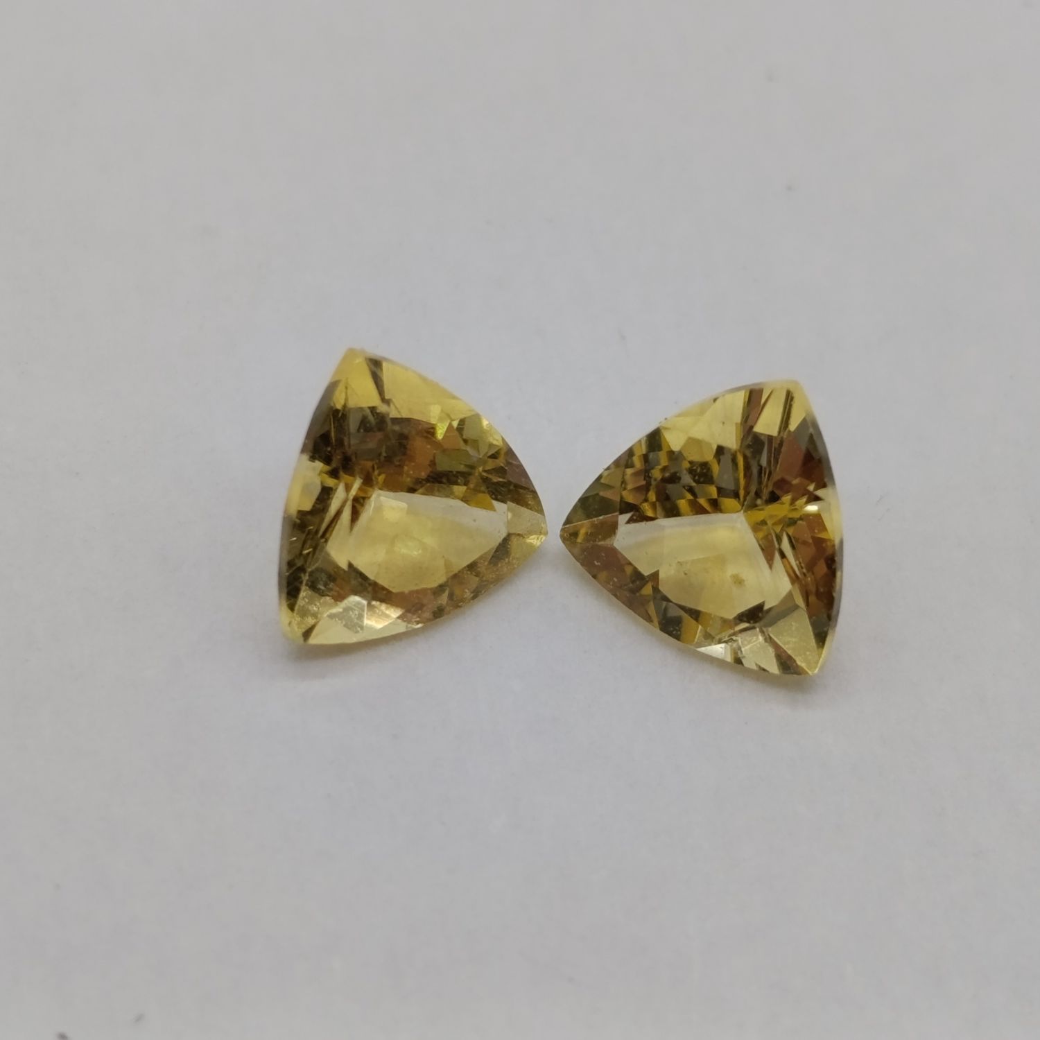 Pair of triangular cut yellow Heliodor (Beryl) stones - each one 65 points - Total 1.3ct
