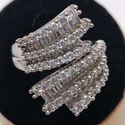Sterling silver ring with 56 round stones and 34 baguette stones - weighs 9.5g
