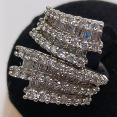 Sterling silver ring with 56 round stones and 34 baguette stones - weighs 9.5g