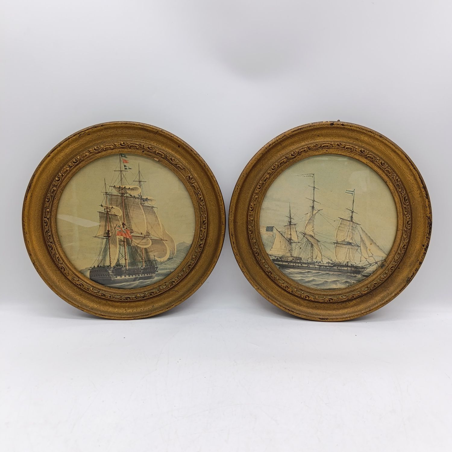 Pair of Porthole-shape frames with pictures of Sailship (British)