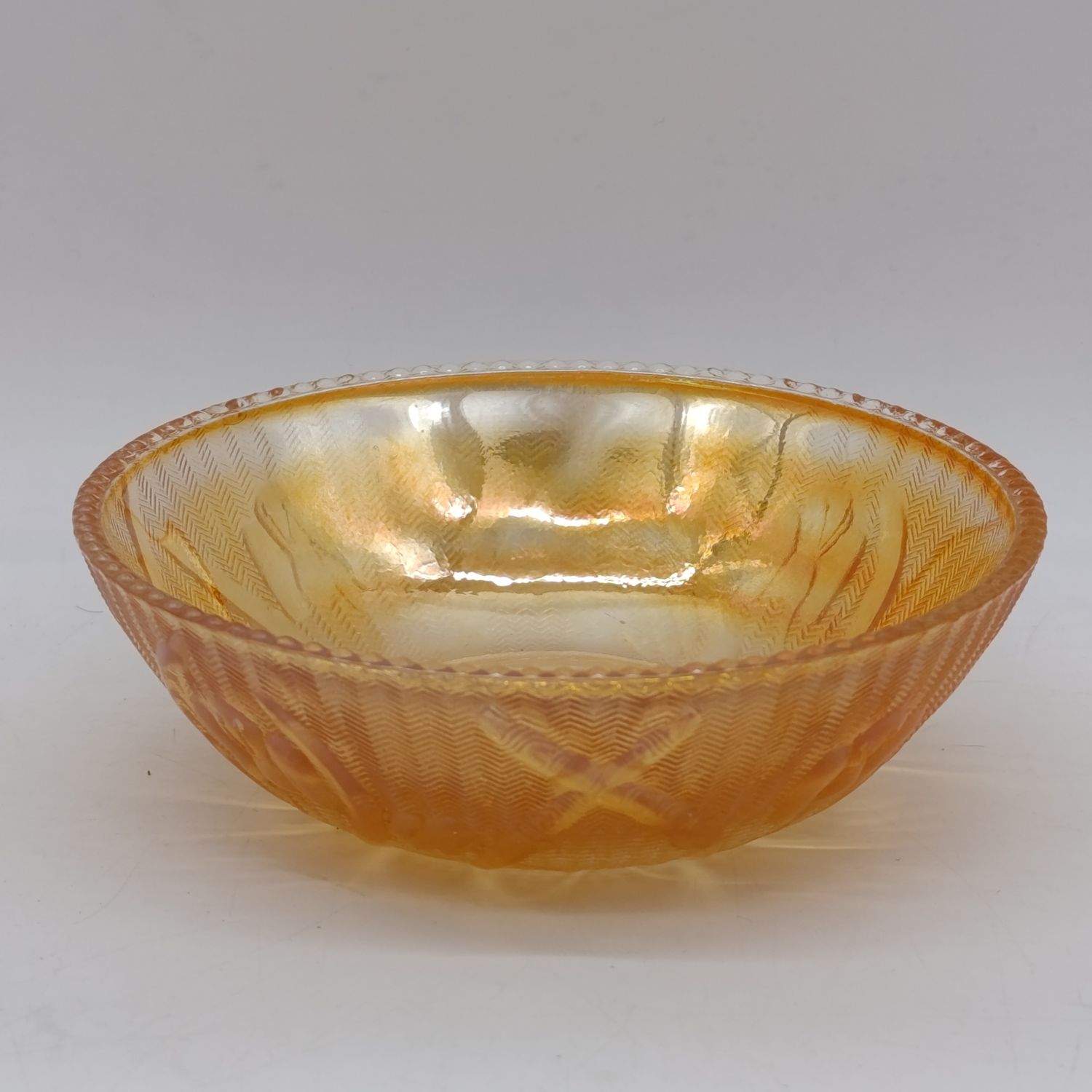 Jeannette Glass Iris and Herringbone marigold carnival glass berry bowls with beaded rim