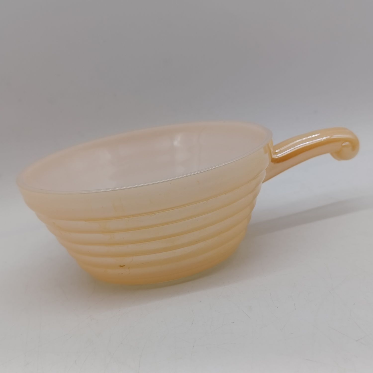 Anchor Hocking Fire-King peach lusterware handled bowl - 1950's - American Kitchenware heatproof milk glass