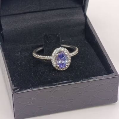 9kt White Gold Tanzanite and Diamond ring - weighs 2.6 grams - size N